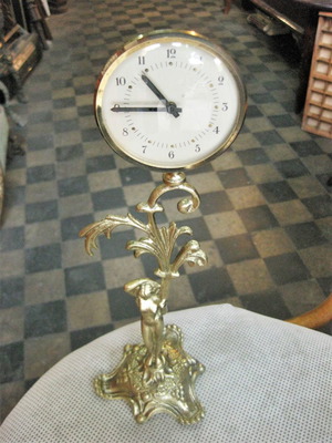 Brass tabletop clock used with decorative base