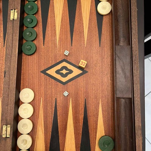 Handmade wooden backgammon used with dice and checkers