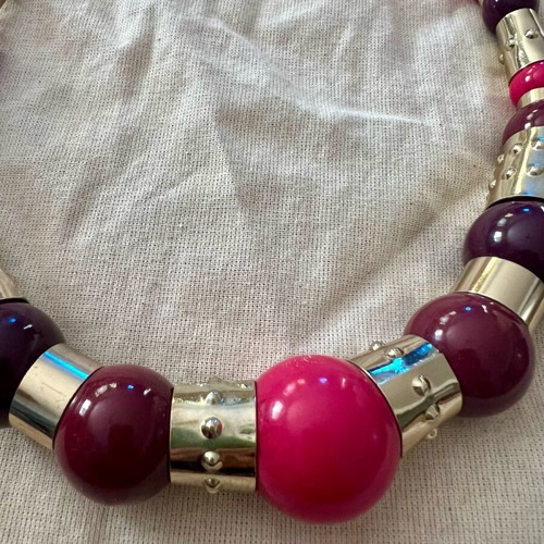 Statement necklace with large beads used, purple and gold details