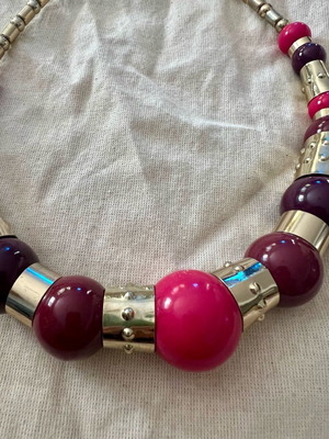 Statement necklace with large beads used, purple and gold details