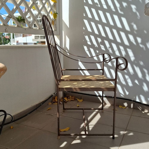 Retro wrought iron garden armchair with cushions used