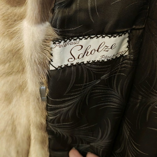 Women's mink fur coat like new with fox or raccoon fur