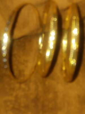 Set of 3 gold bracelets with design