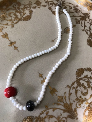 Beaded necklace like new, white with red and black beads