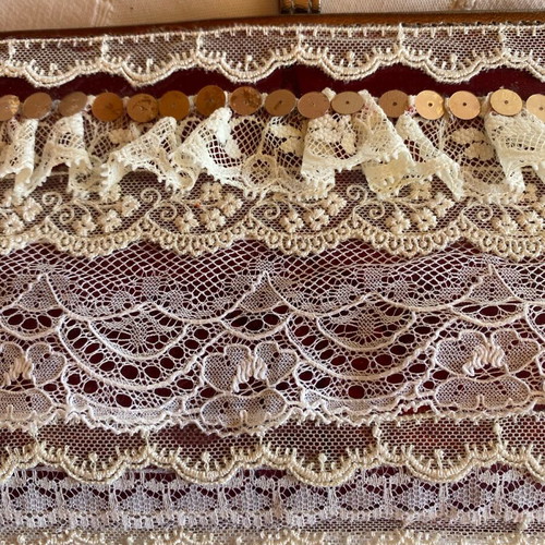 Evening hand bag like new with romantic lace decoration and copper tone