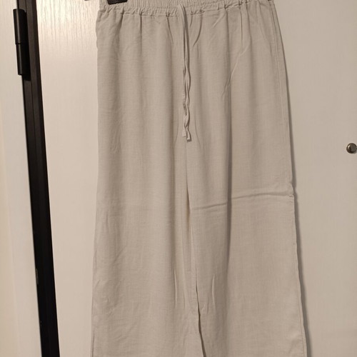 Women's loose beige pants with elastic waist and drawstring