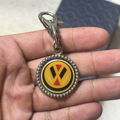 Volkswagen vintage metal keychain with classic logo, used