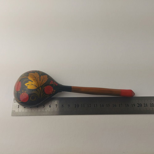 Old painted wooden spoon used