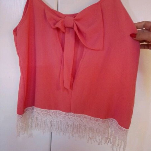 Blouse new with bow back and fringes bottom size L