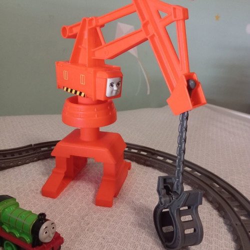 Thomas The Tank Engine train set like new with tracks, three trains, crane, and slide