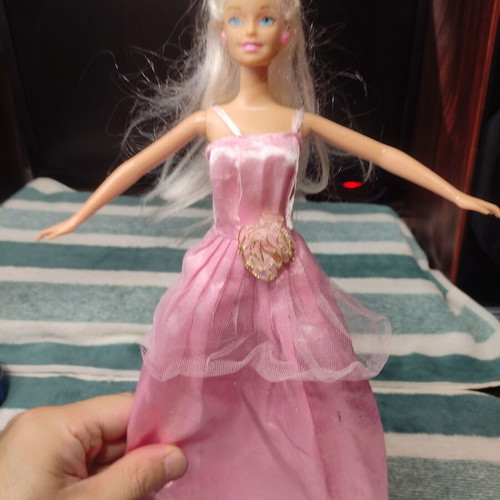 Barbie doll used with dress tears
