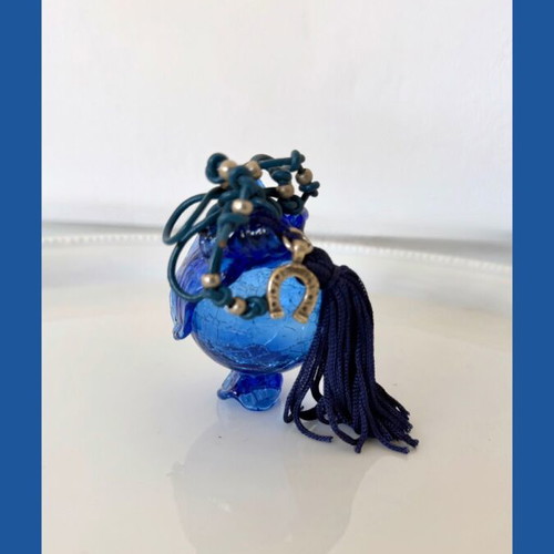 Handmade glass lucky charm in blue shades with horseshoe and silk tassel
