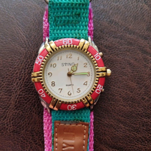 Vintage wristwatch new with metal dial and luminous hands