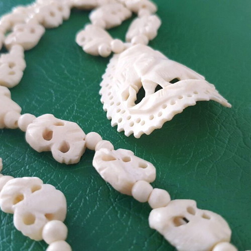 Carved vintage bone necklace with elephant pendant