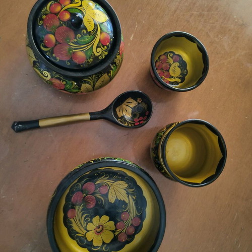 Vintage Russian-style wooden utensils and spoon hand-painted