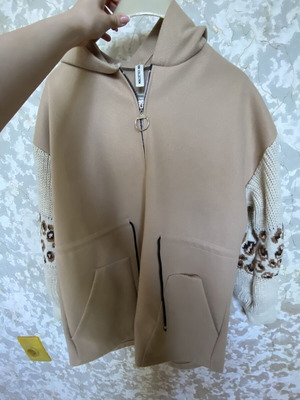 Women's beige coat with soft sleeves