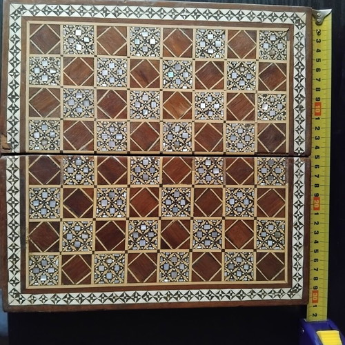 Handmade chess with mother-of-pearl and ancient Egyptian figures used