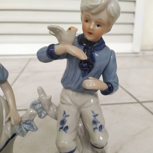 Vintage decorative figurines of boy and girl like new, 19 cm tall