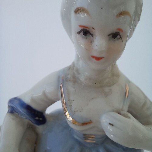 Porcelain figurine used with peasant girl