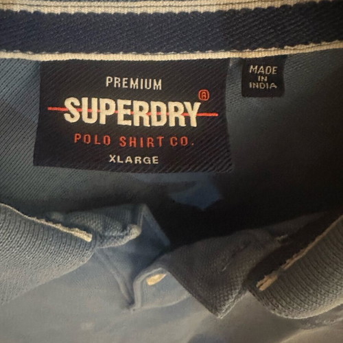 Superdry Polo shirt size XL like new, sea blue with small white defect
