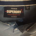 Superdry Polo shirt size XL like new, sea blue with small white defect