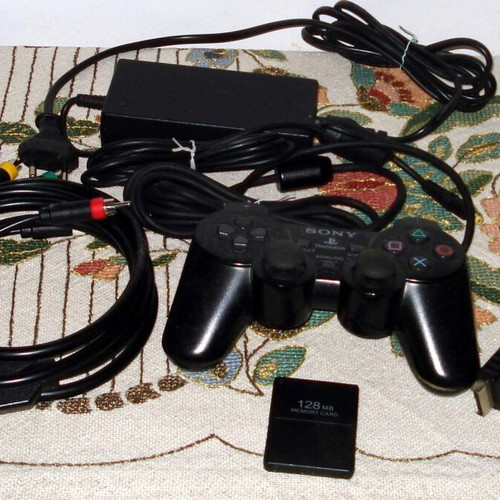 Sony PlayStation 2 Slim SCPH-70004 console bundle with controller and games