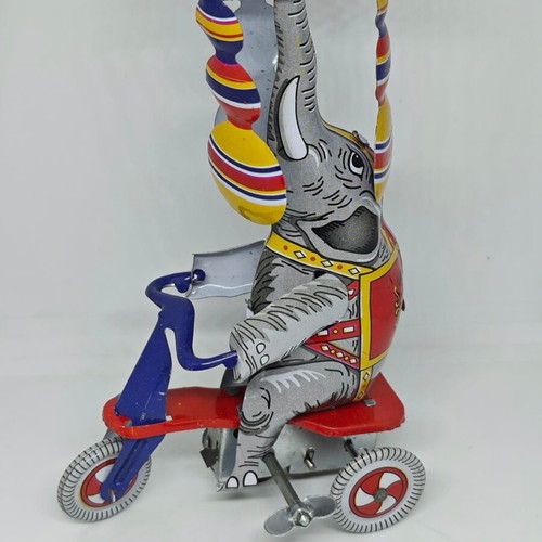 Vintage metal elephant on tricycle like new