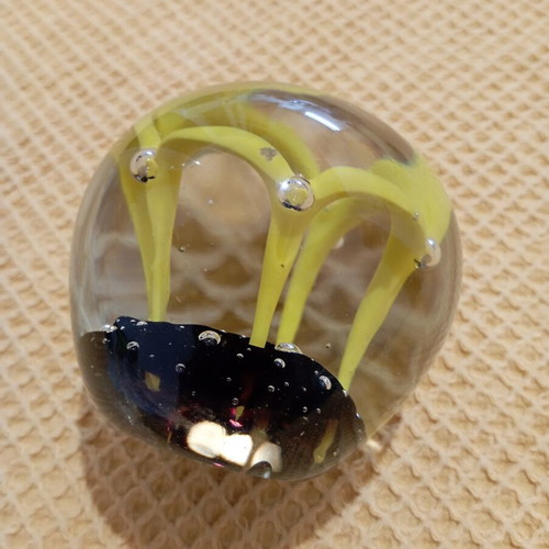 Vintage glass paperweight with yellow dome design