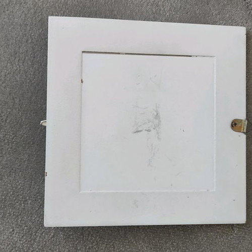Picture frame hanger used with corner wear