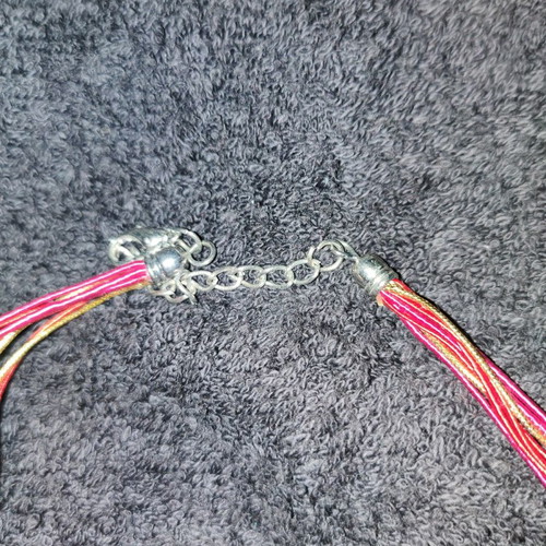 Handmade pendant new with colorful cords and silver clasp