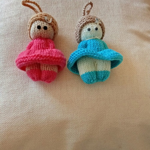 Knitted dolls pair handmade with needles