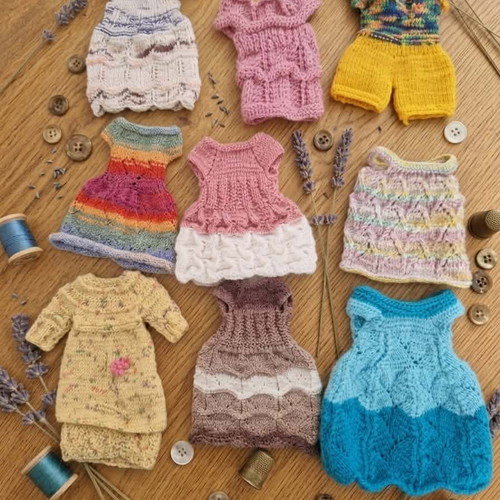 Handmade knitted doll clothes in various colors