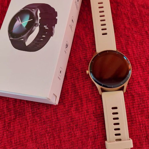 Smart watch, gold with beige strap and black with extra straps