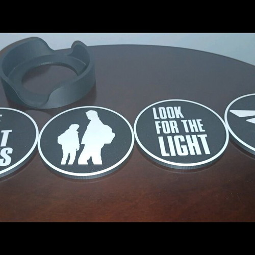 Last of Us coasters like new, set of 4 with base