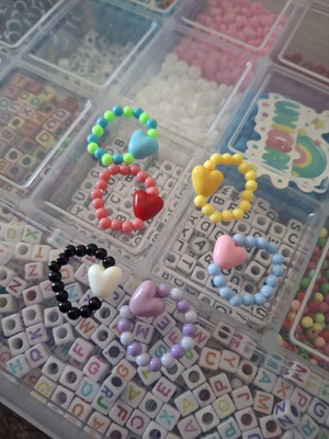 Elastic beaded ring with heart charm