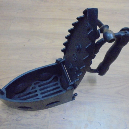 Antique charcoal iron restored with internal grill