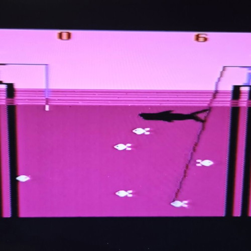 Atari 2600 VCS Woody console used with two joysticks and Demon Attack game