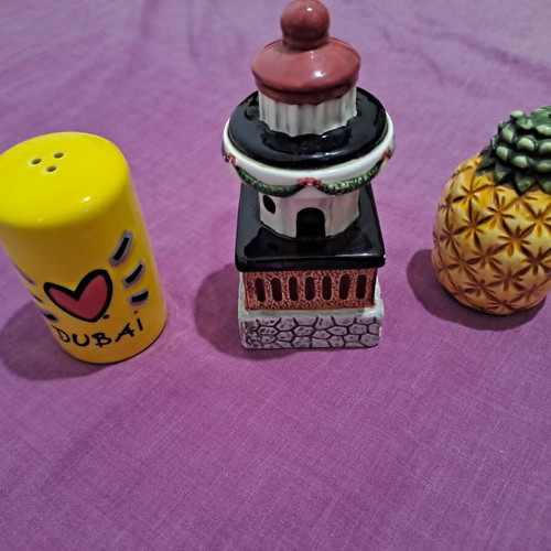 Salt and pepper shakers used, designs lighthouse, pineapple, Dubai
