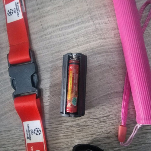 Flashlight, selfie stick and three keychain lemus used