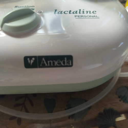 Ameda Double Breast Pump like new with 3 bottles and milk storage bags