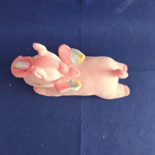 Pink plush unicorn with colorful wings