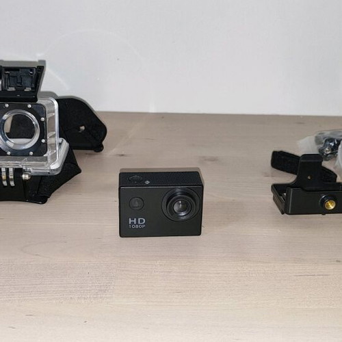 Action camera like new with waterproof case and mounting accessories