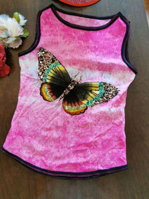 Women's pink polyester top with butterfly, size M