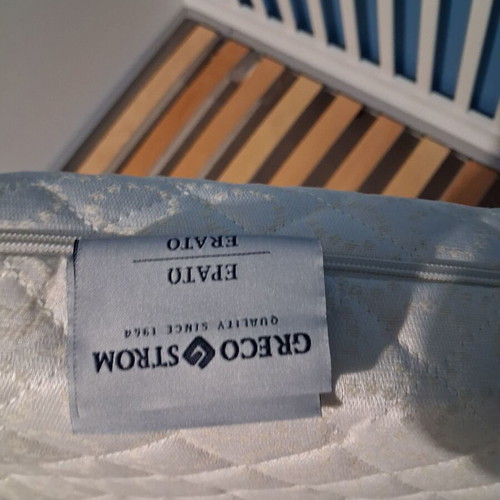 Baby cot with rails, like new, includes mattress and protector