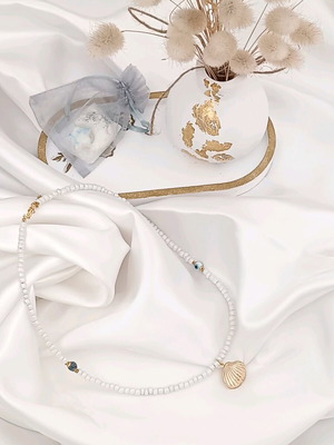 Summer women's white necklace with an eye, blue agate & gold-plated shell charm