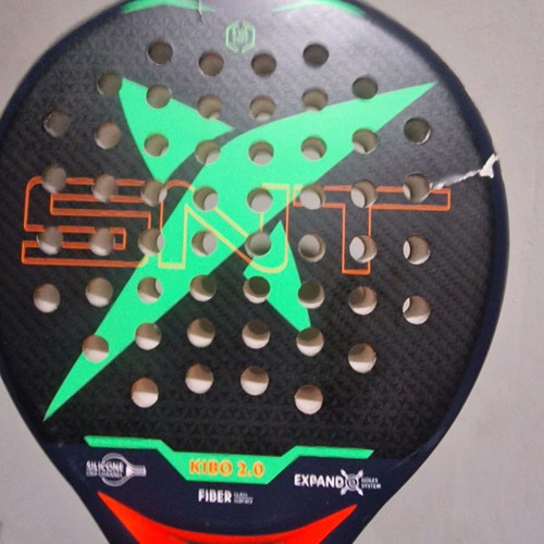 Padel racket used, moderate condition with small cracks