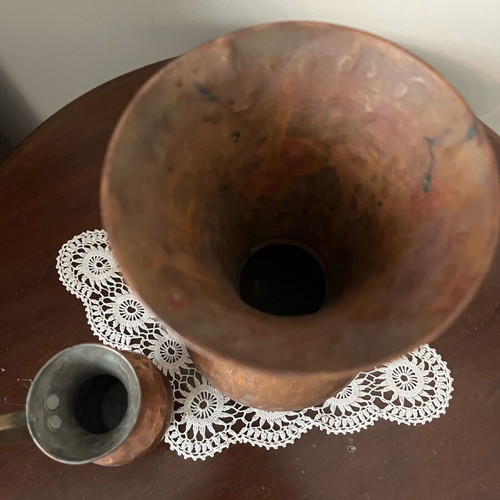 Two decorative hammered copper vases used with natural patina