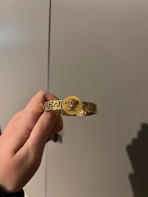 Versace gold hand bracelet like new
