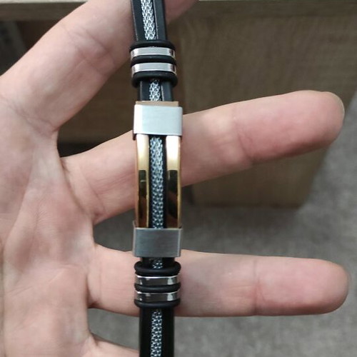 Stainless Steel Bracelet like new with gold chain and black rubber band
