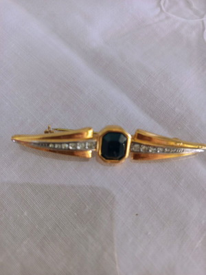 Brooch with large black stone and sparkling rhinestones used